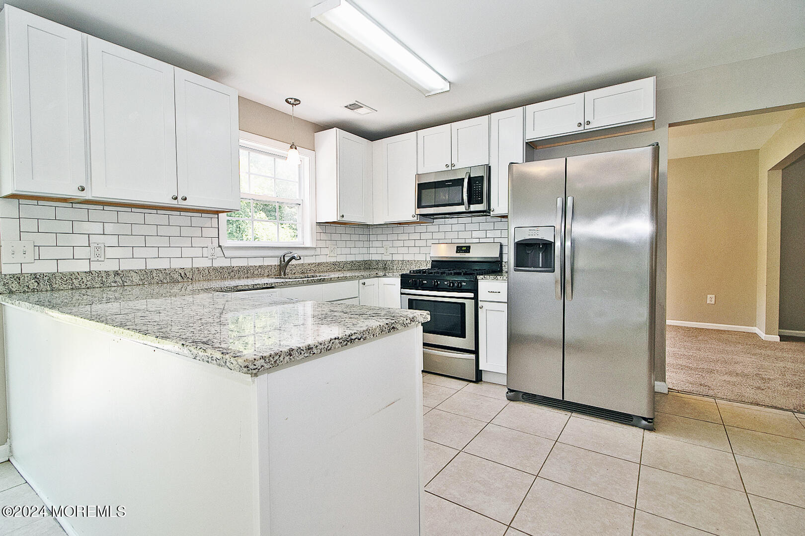 79 Timberline Road Bayville, NJ 08721 - Photo 17 of 40 a kitchen with stainless steel appliances granite countertop a refrigerator sink and stove