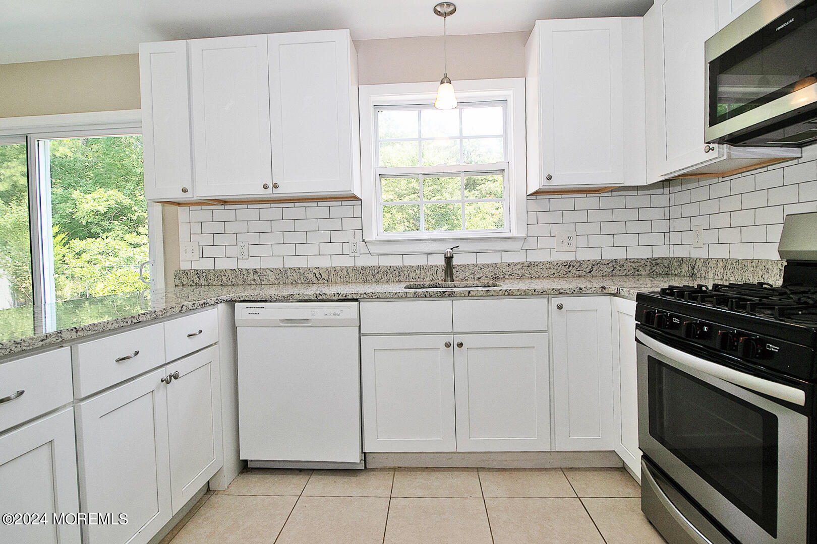 79 Timberline Road Bayville, NJ 08721 - Photo 18 of 40 a kitchen with granite countertop white cabinets stainless steel appliances and a window