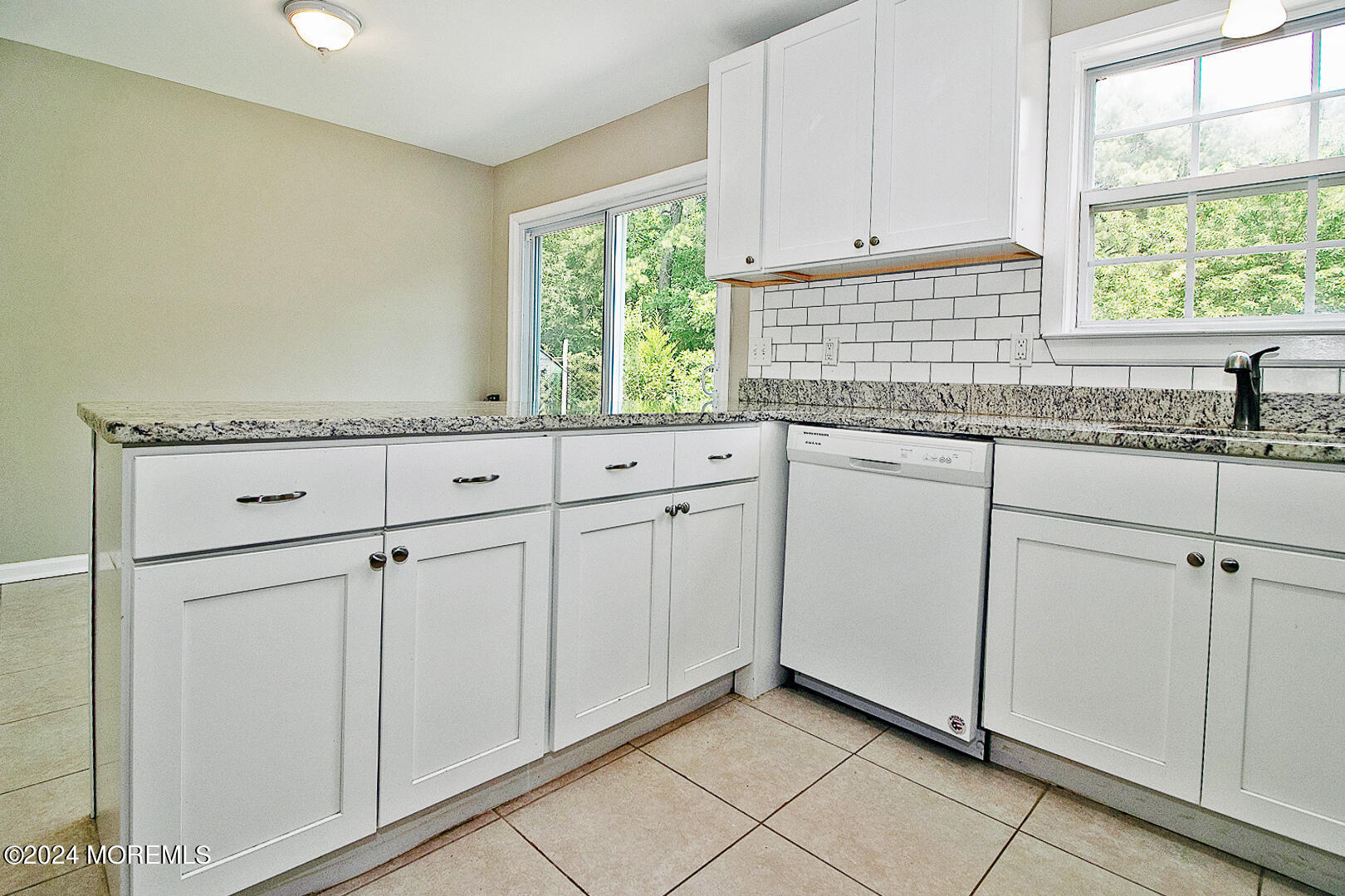 79 Timberline Road Bayville, NJ 08721 - Photo 19 of 40 a kitchen with white cabinets and window