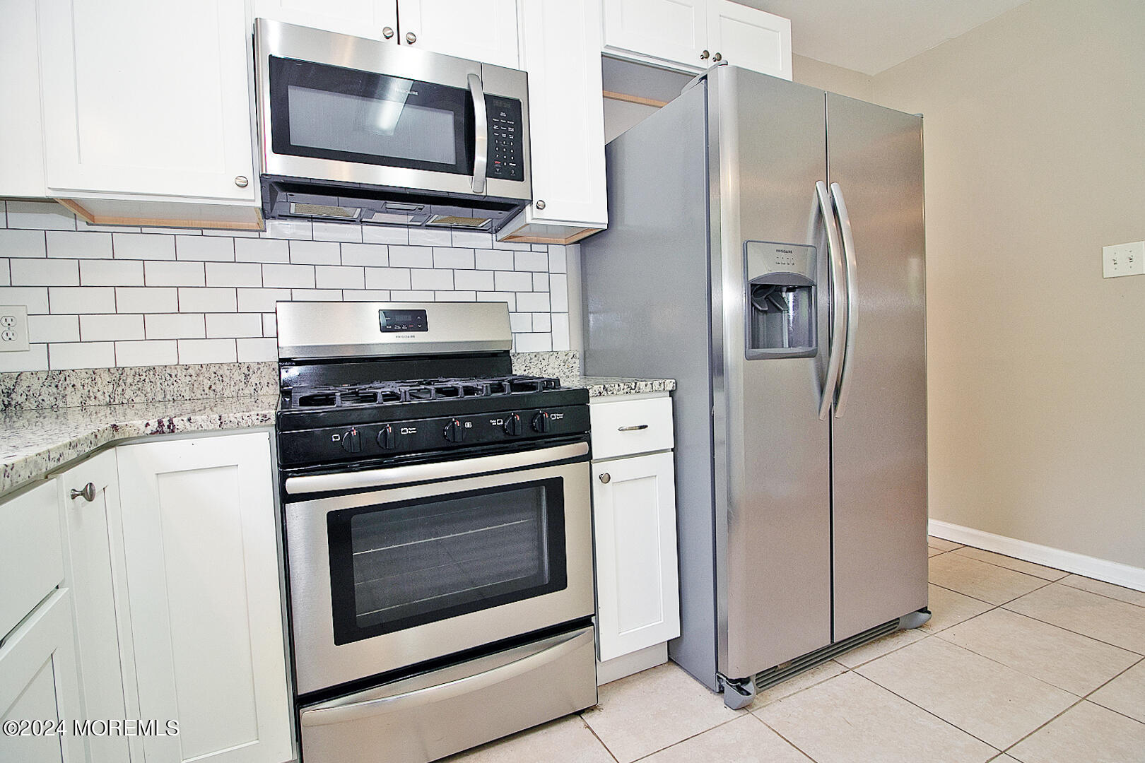 79 Timberline Road Bayville, NJ 08721 - Photo 20 of 40 a kitchen with stainless steel appliances white cabinets a stove top oven a sink and dishwasher