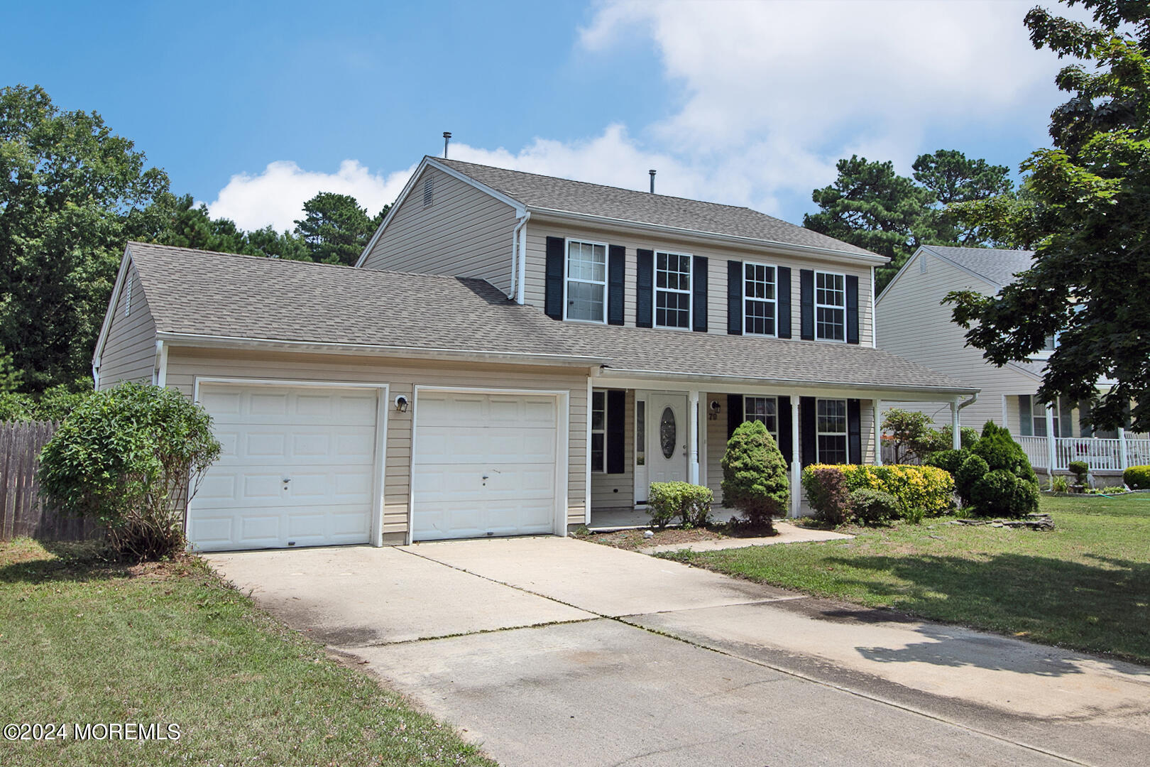 79 Timberline Road Bayville, NJ 08721 - Photo 2 of 40 a front view of a house with a garden and plants