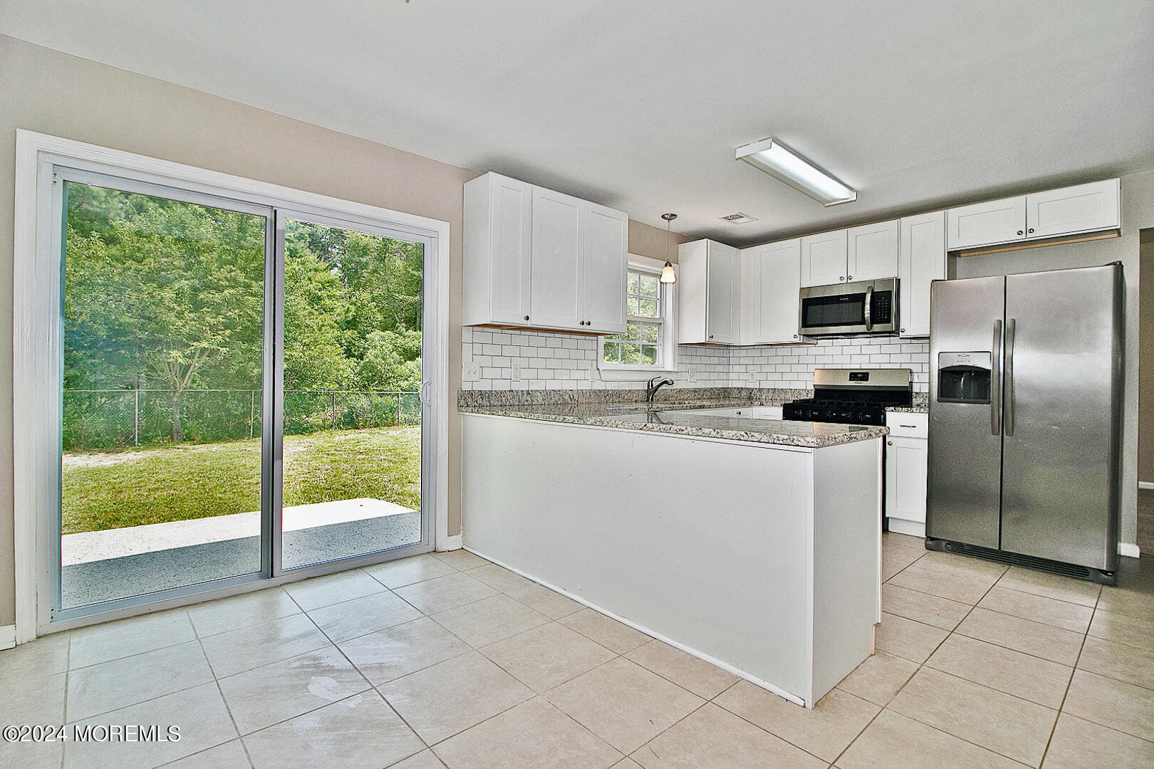 79 Timberline Road Bayville, NJ 08721 - Photo 22 of 40 a kitchen with a refrigerator a sink and a stove top oven