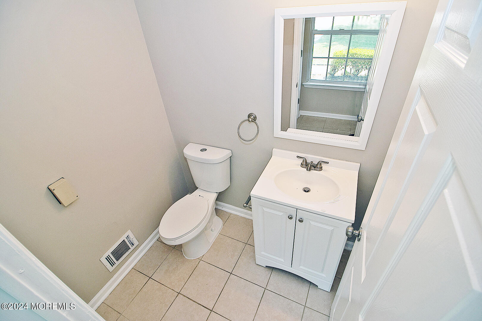 79 Timberline Road Bayville, NJ 08721 - Photo 26 of 40 a bathroom with a toilet sink and mirror with window