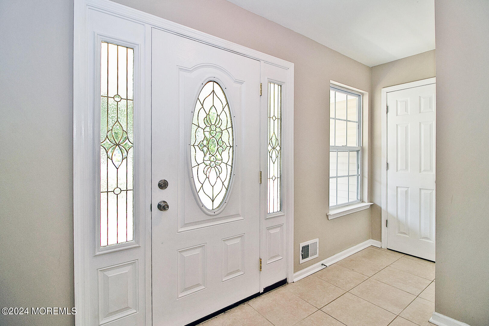 79 Timberline Road Bayville, NJ 08721 - Photo 10 of 40 an entryway with wooden floor mirror and windows