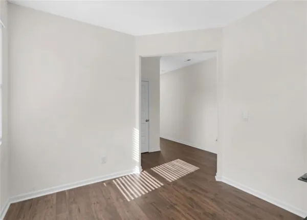 an empty room with wooden floor