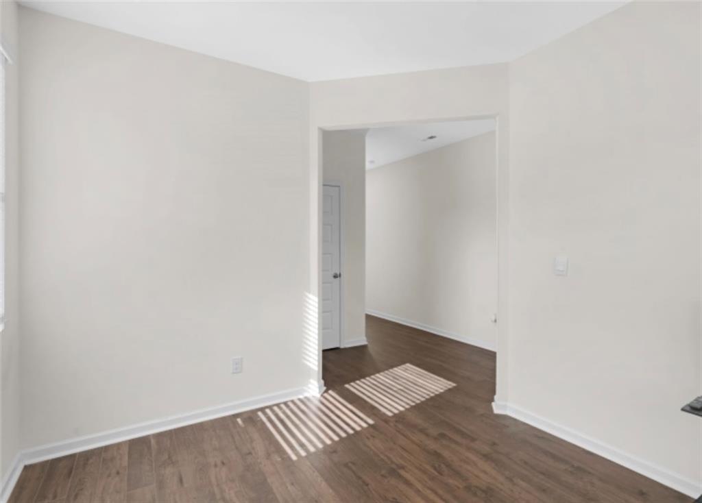 160 Grafton Street Hampton, GA 30228 - Photo 12 of 15 an empty room with wooden floor