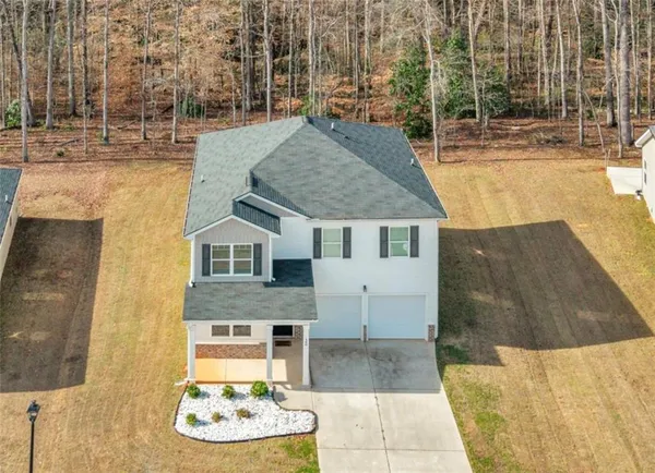 a front view of a house with a yard