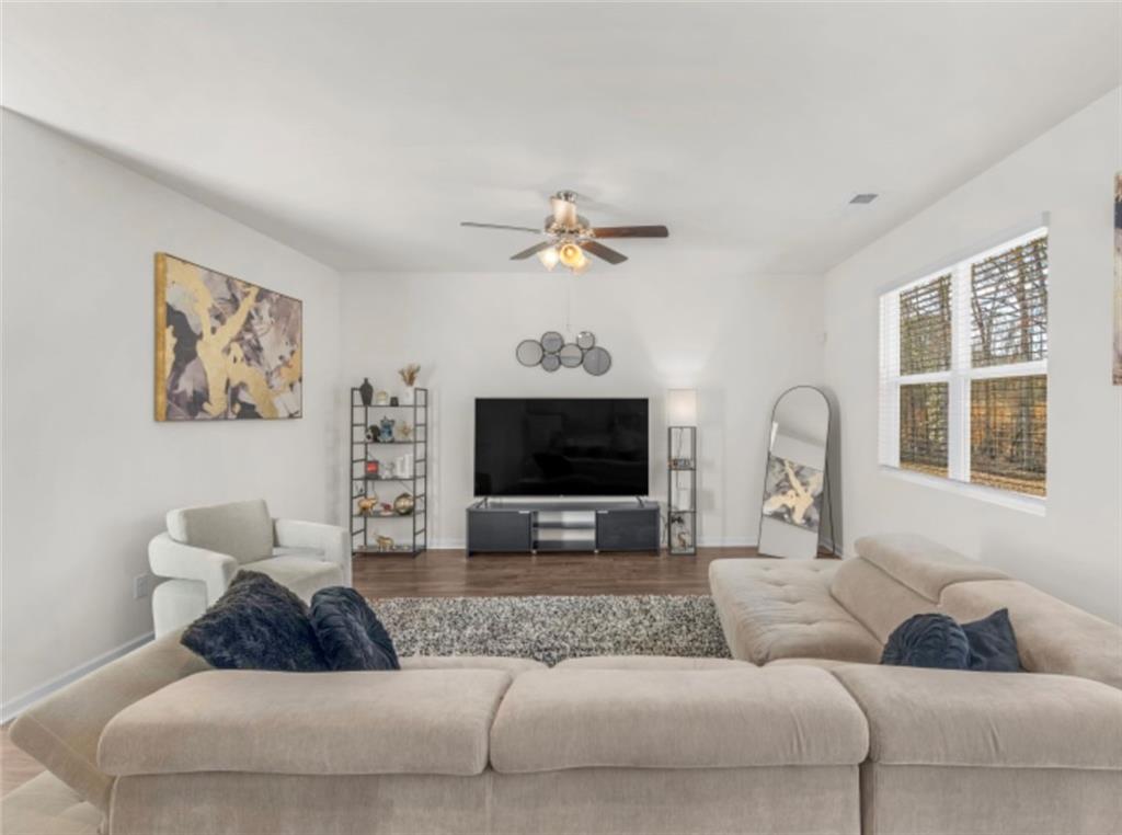 160 Grafton Street Hampton, GA 30228 - Photo 4 of 15 a living room with furniture and a flat screen tv