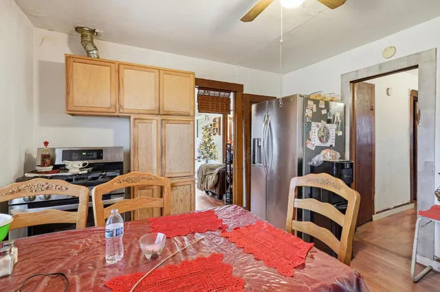 a bedroom with furniture and a flat screen tv