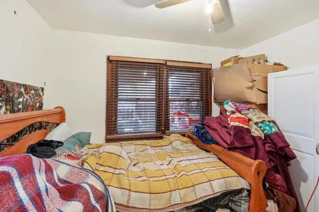 a bathroom with a sink vanity and shower