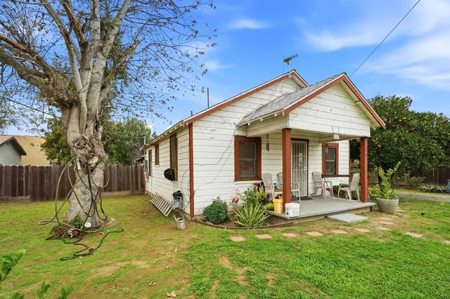 a backyard of a house with seating space