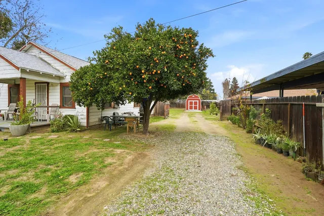 a front view of house with garden
