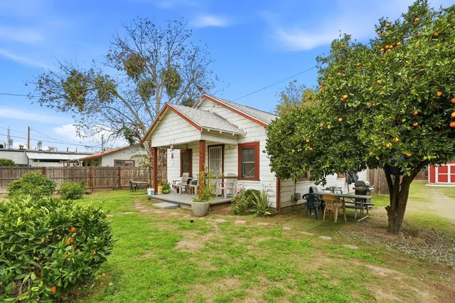 a front view of a house with garden