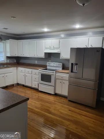 a kitchen with a cabinets and a stove