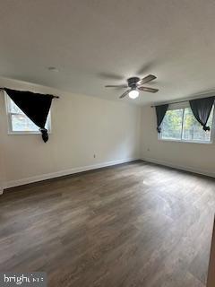 3831 Hamilton Street, Unit F102 Hyattsville, MD 20781 - Photo 11 of 12 an empty room with a ceiling fan and window