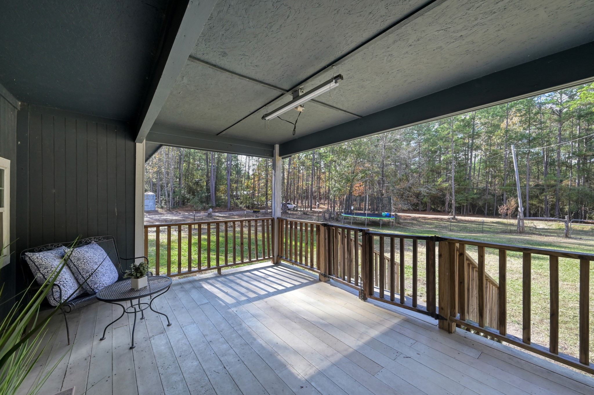169 Gladys Lane Trinity, TX 75862 - Photo 5 of 25 Spacious front porch with view of front yard and driveway