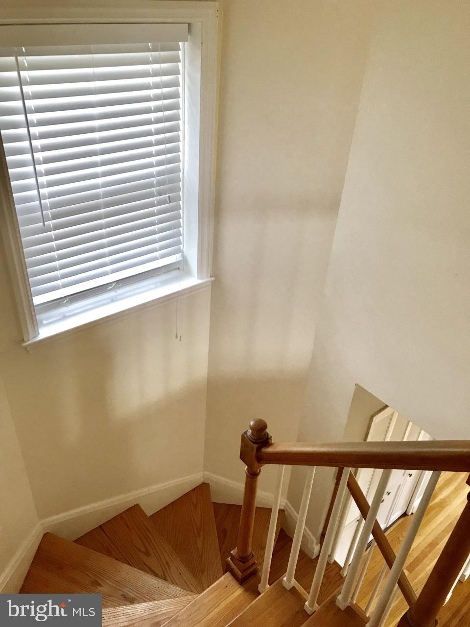 7504 Rocksham Drive Baltimore, MD 21286 - Photo 11 of 24 Staircase from living room to bedroom level.