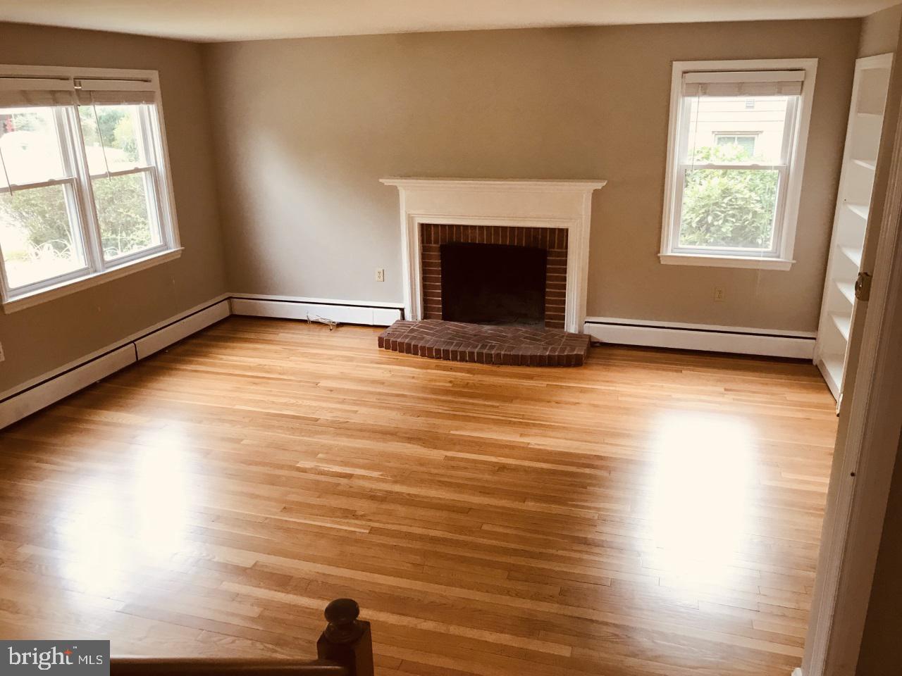 7504 Rocksham Drive Baltimore, MD 21286 - Photo 3 of 24 Bright living room with fireplace & built-ins.