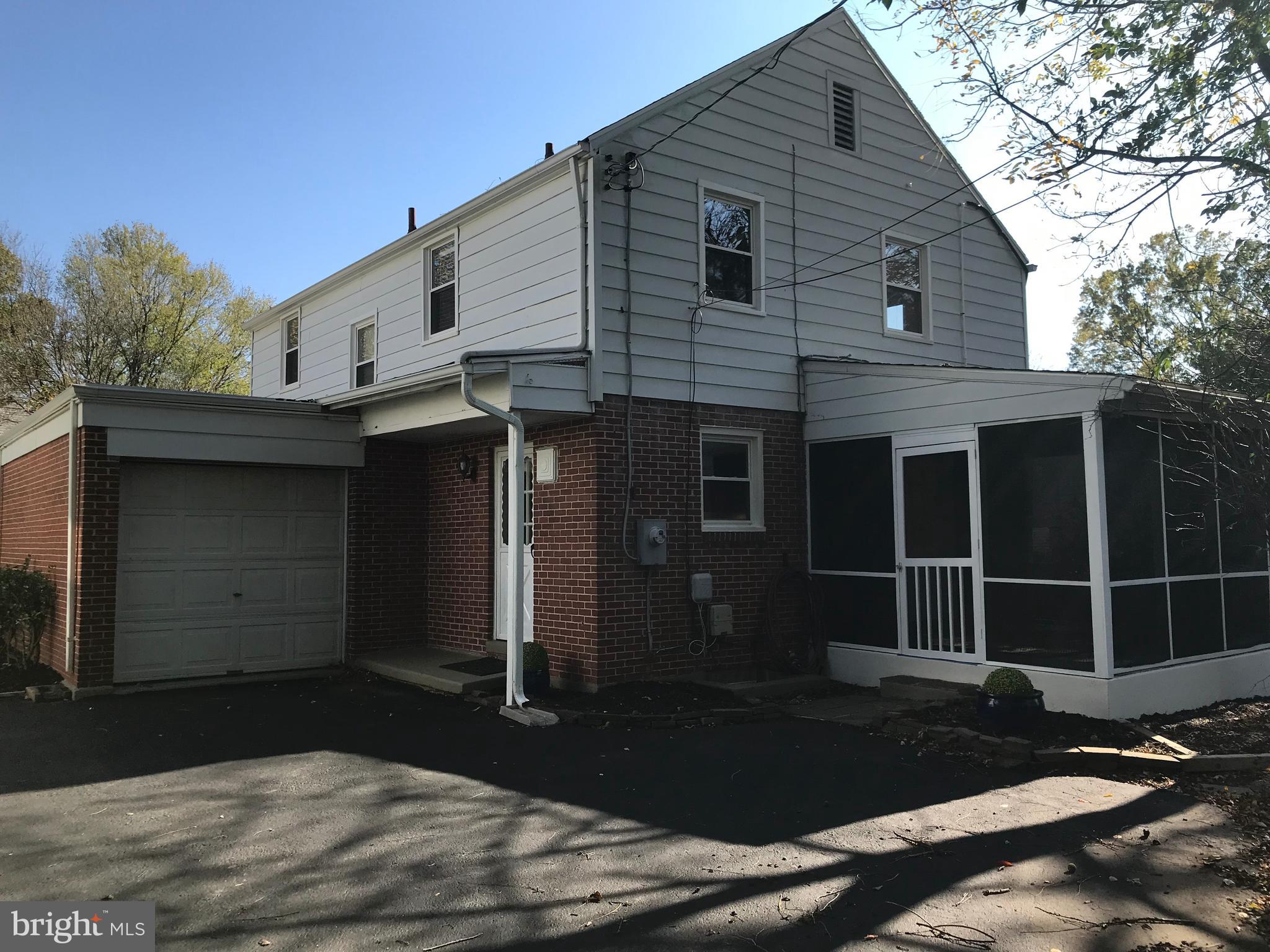 7504 Rocksham Drive Baltimore, MD 21286 - Photo 22 of 24 rear view showing rear loading gar. & screen porch