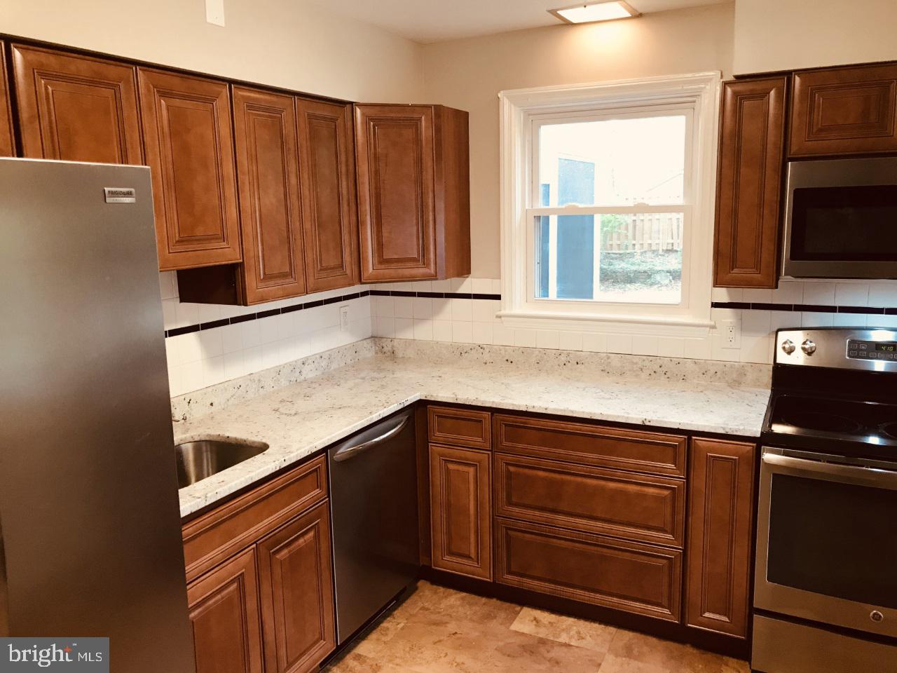 7504 Rocksham Drive Baltimore, MD 21286 - Photo 7 of 24 Kitchen totally redone w/granite & stainless steel