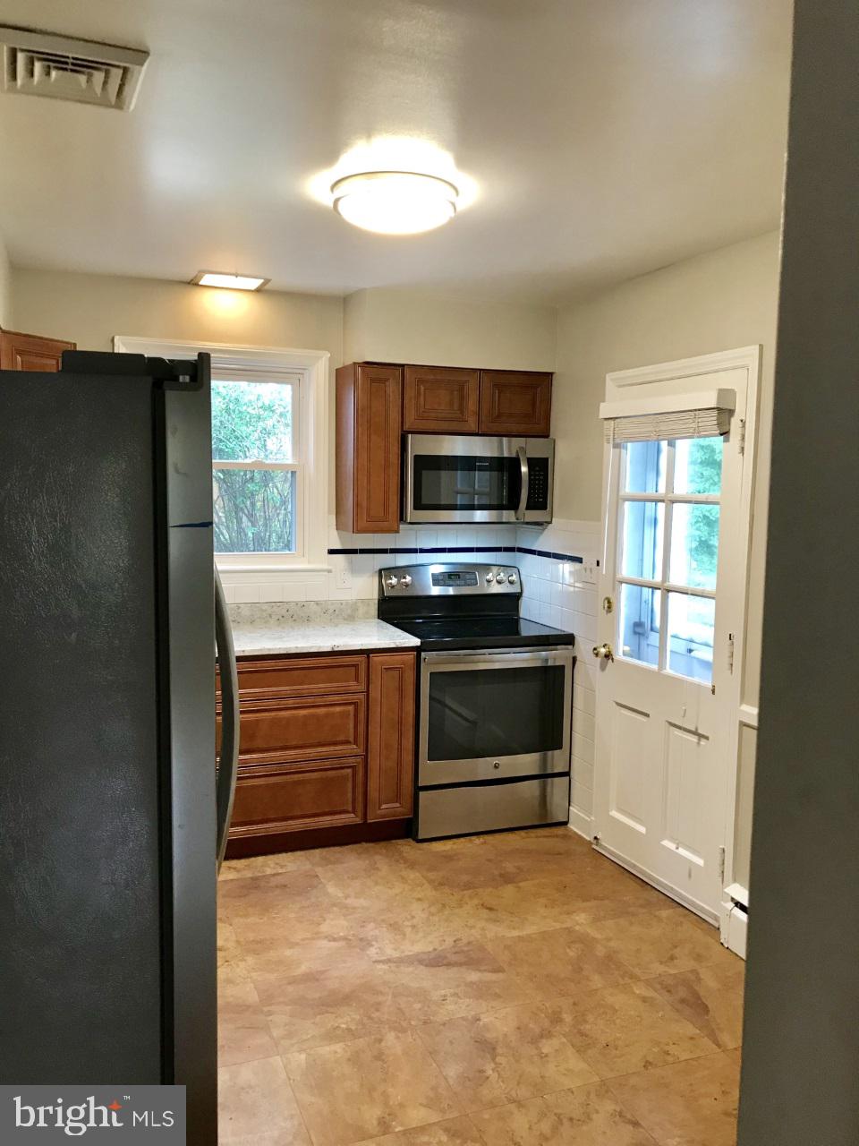 7504 Rocksham Drive Baltimore, MD 21286 - Photo 10 of 24 Kitchen with side door access to driveway & garage