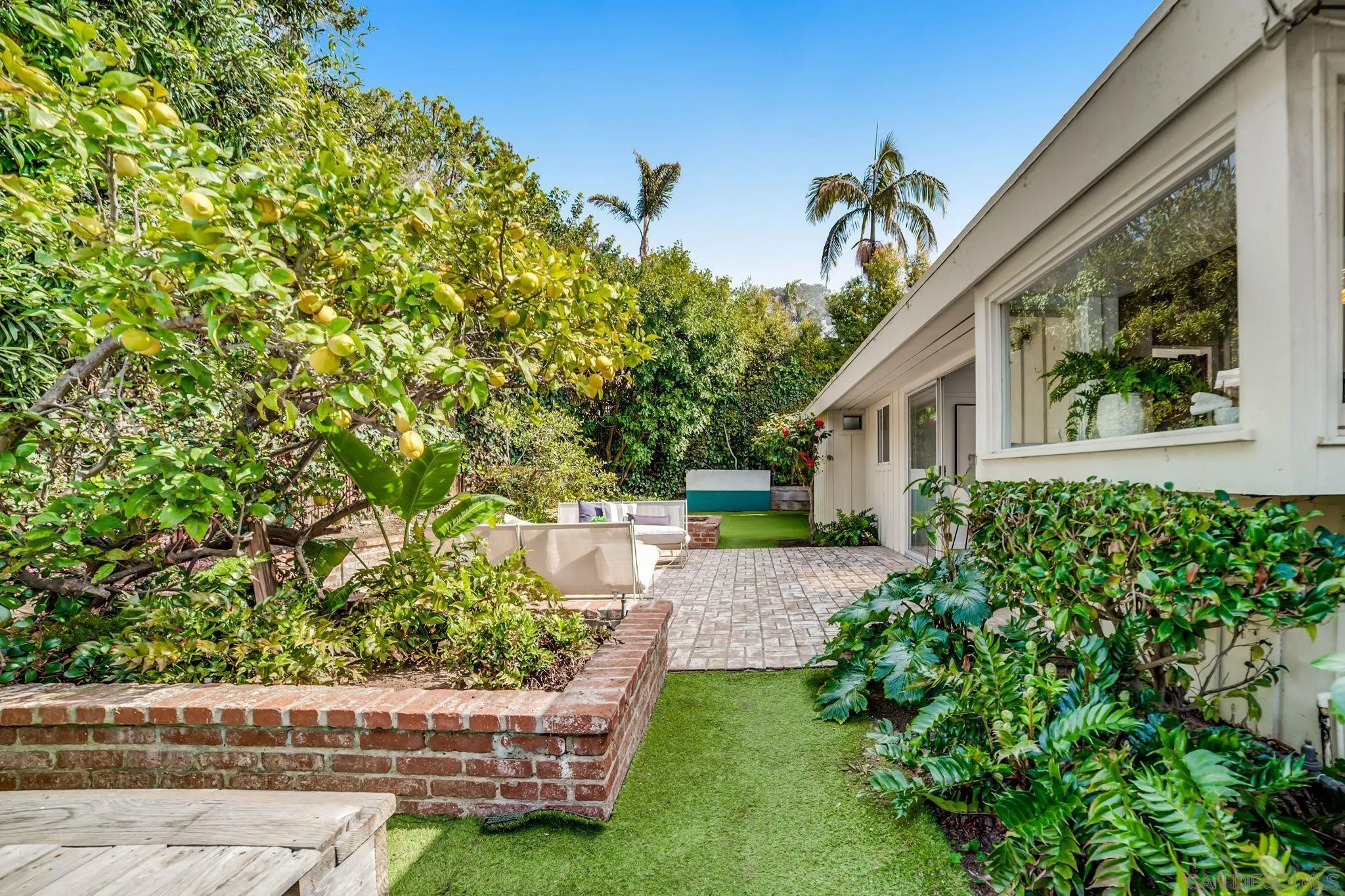 624 8th Street Del Mar, CA 92014 - Photo 15 of 25 a view of a house with backyard and sitting area
