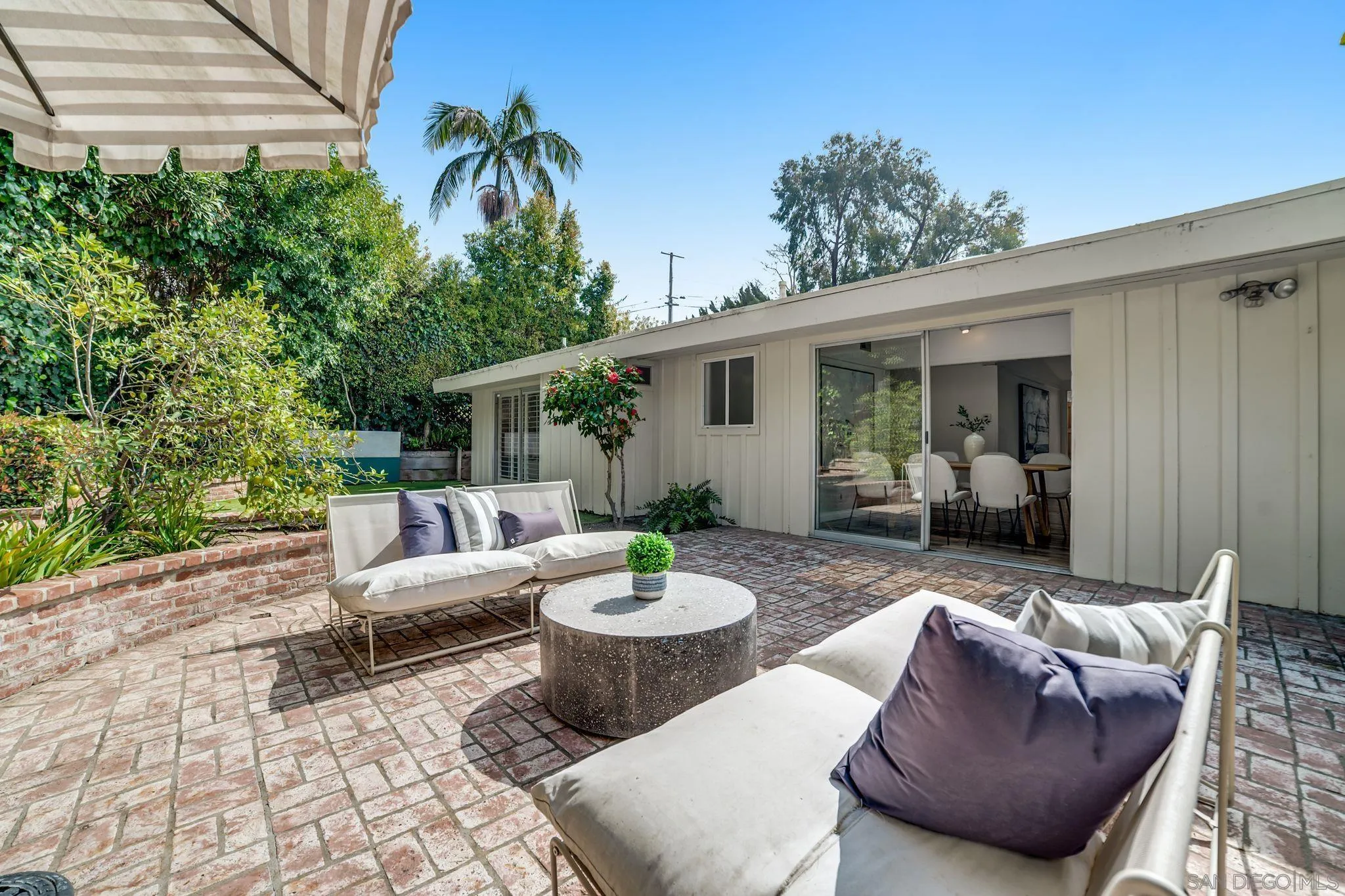 624 8th Street Del Mar, CA 92014 - Photo 16 of 25 a view of a patio with a dining table and chairs