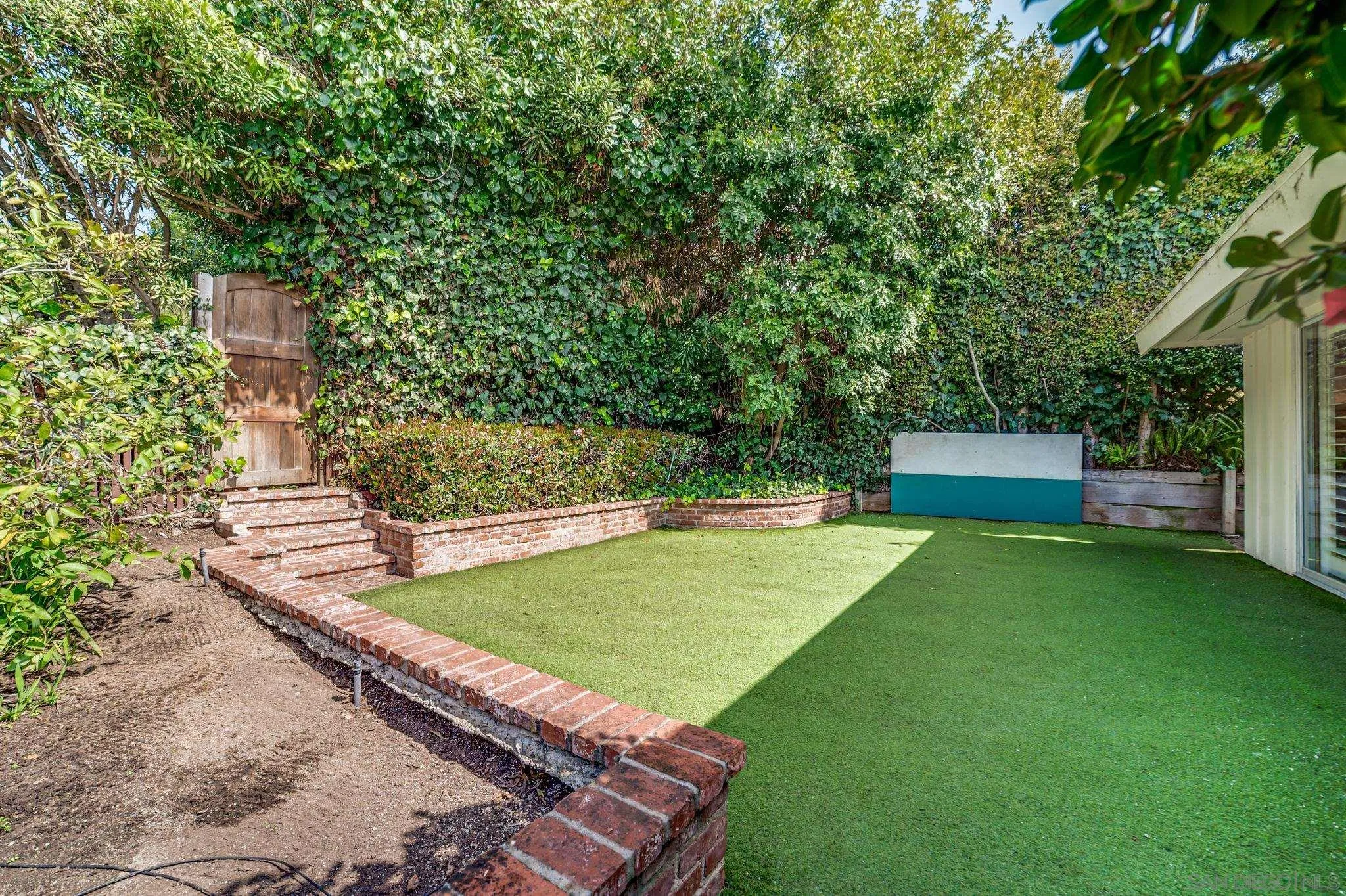 624 8th Street Del Mar, CA 92014 - Photo 17 of 25 a view of a backyard with swimming pool