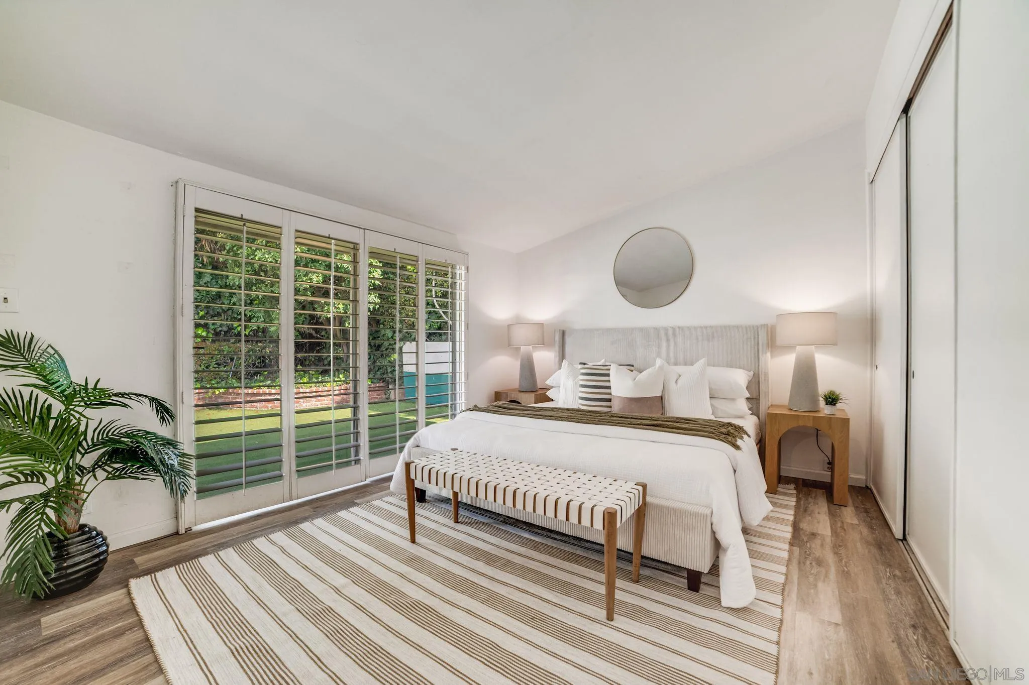 624 8th Street Del Mar, CA 92014 - Photo 20 of 25 a bedroom with a bed and window