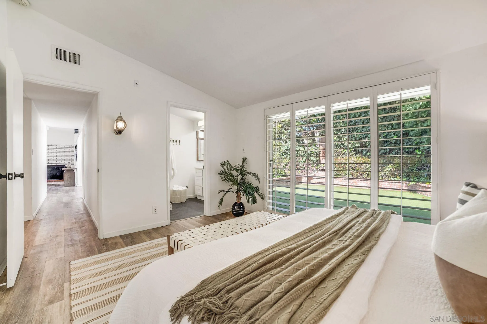 624 8th Street Del Mar, CA 92014 - Photo 21 of 25 a bedroom with a bed and a large window