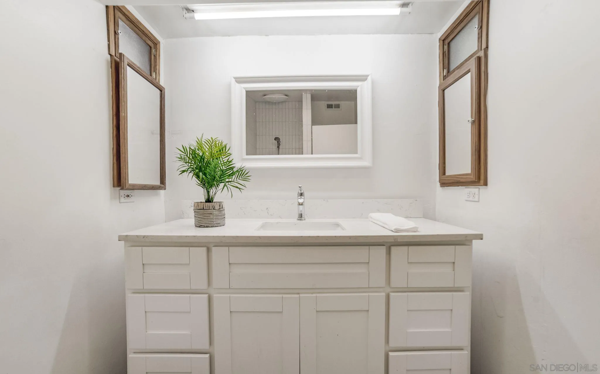 624 8th Street Del Mar, CA 92014 - Photo 22 of 25 a bathroom with a sink and a mirror