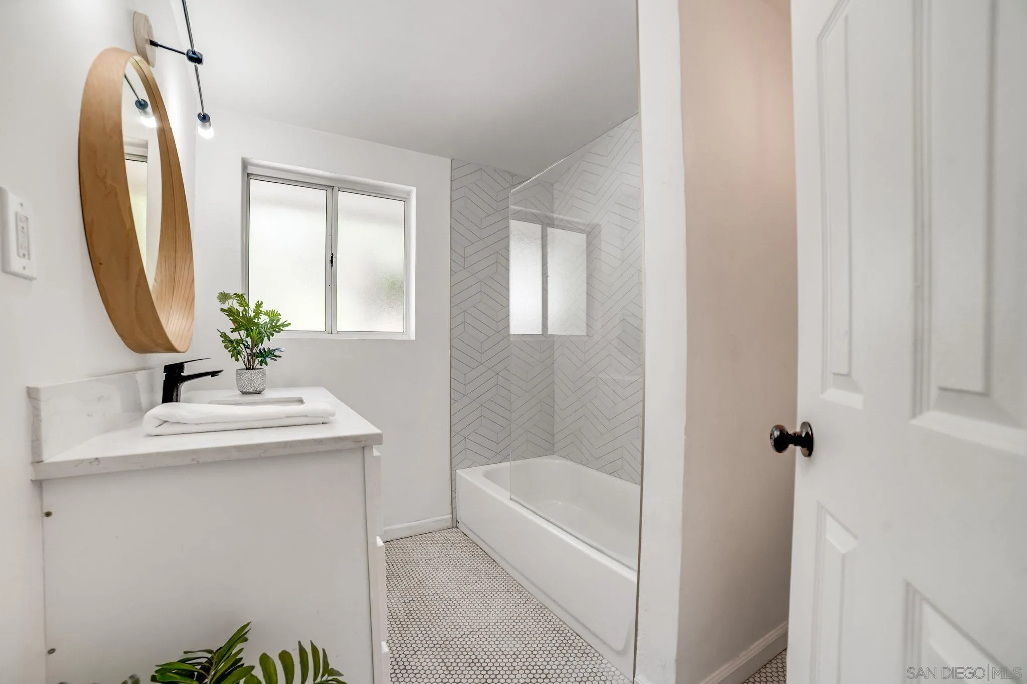 624 8th Street Del Mar, CA 92014 - Photo 24 of 25 a bath room with a sink and a mirror