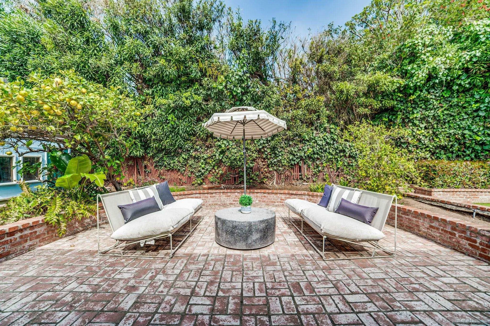 624 8th Street Del Mar, CA 92014 - Photo 3 of 25 a view of a patio with couple of chairs and a fire pit