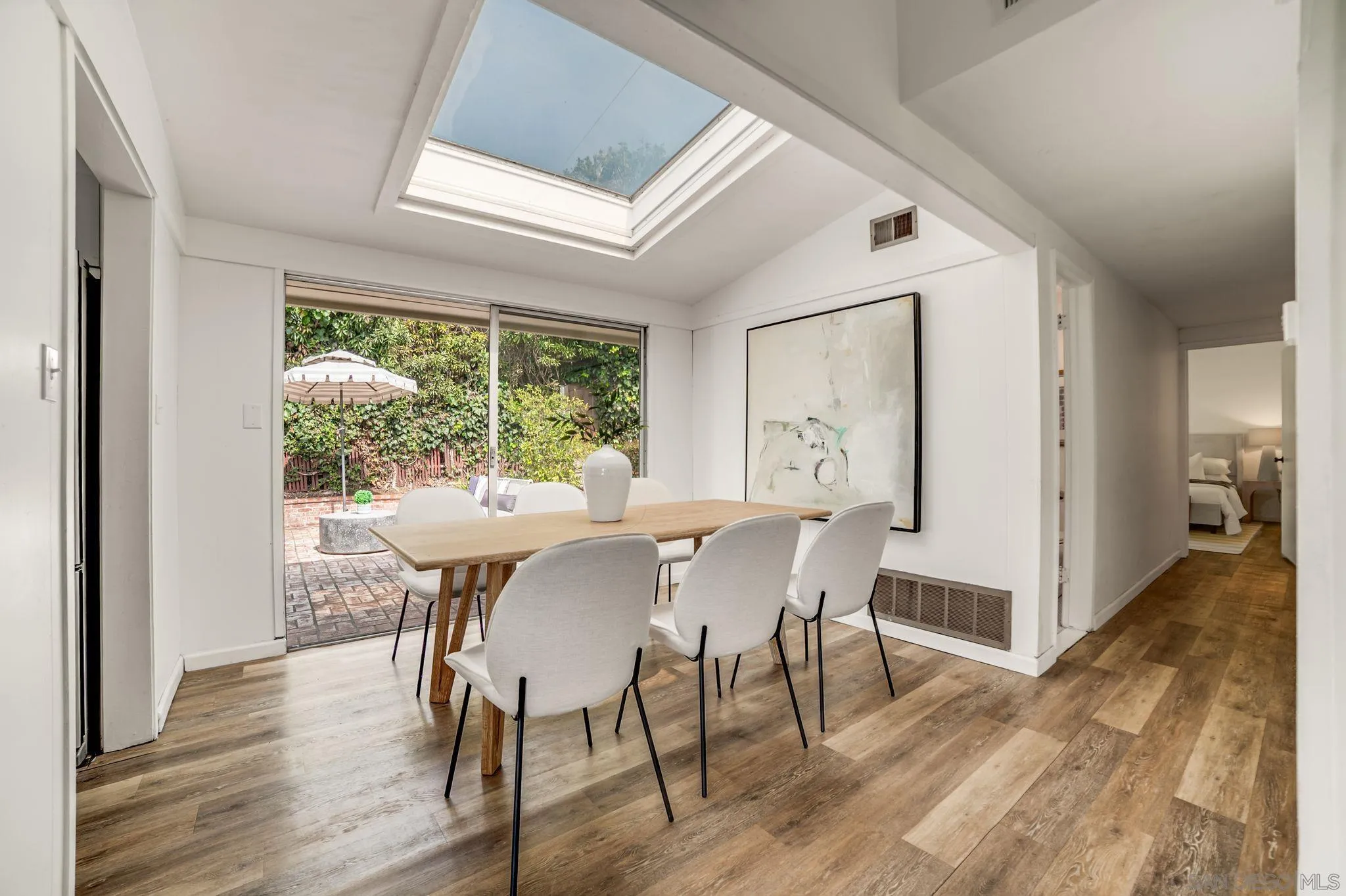 624 8th Street Del Mar, CA 92014 - Photo 8 of 25 a view of a dining room with furniture window and wooden floor