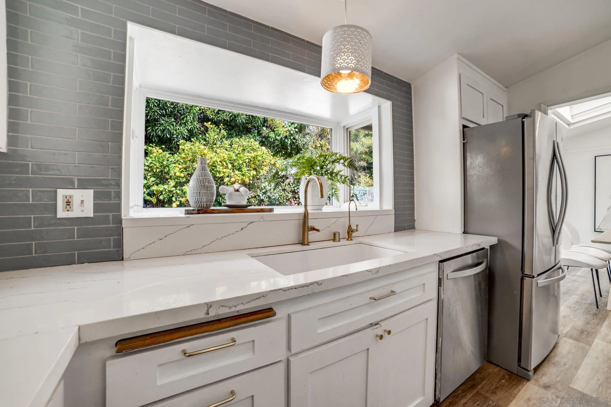 624 8th Street Del Mar, CA 92014 - Photo 10 of 25 a kitchen with a sink and a refrigerator