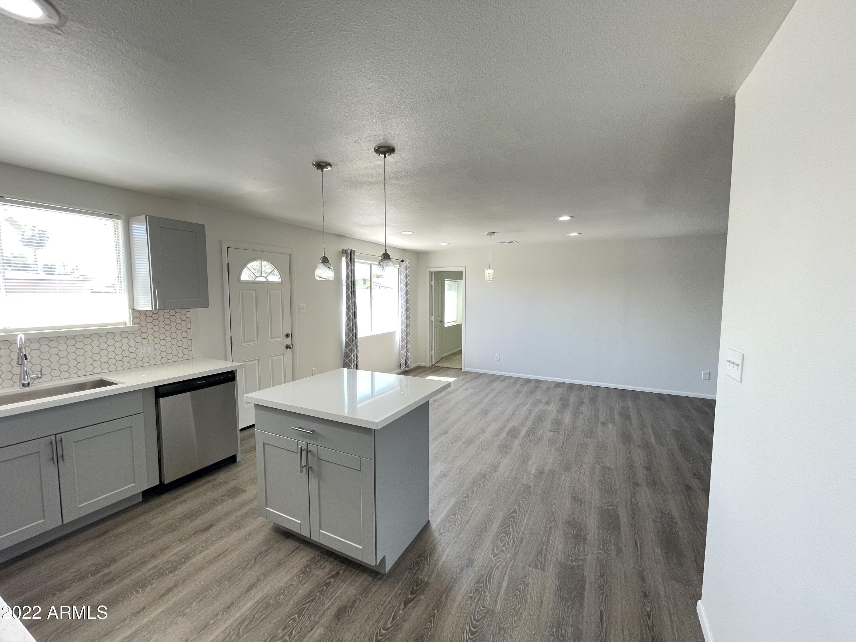 5207 West Osborn Road Phoenix, AZ 85031 - Photo 19 of 35 a large kitchen with a sink and dish washer