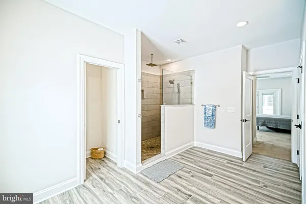 a white toilet sitting next to a window