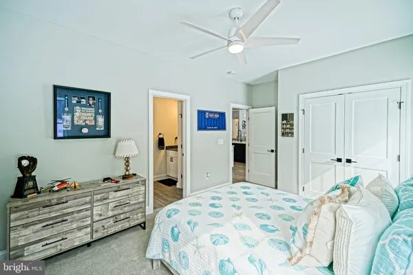 a bedroom with a bed and a fireplace