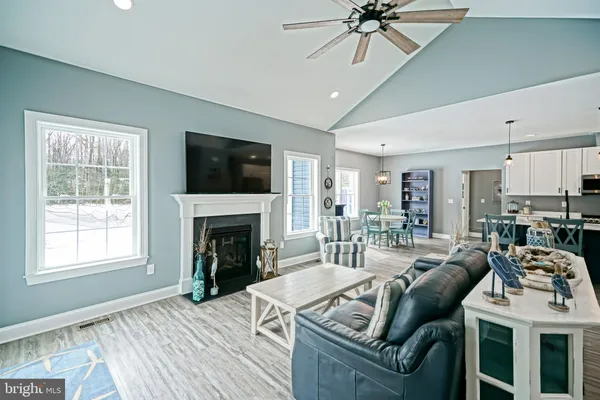 a kitchen with stainless steel appliances a refrigerator stove microwave and white cabinets