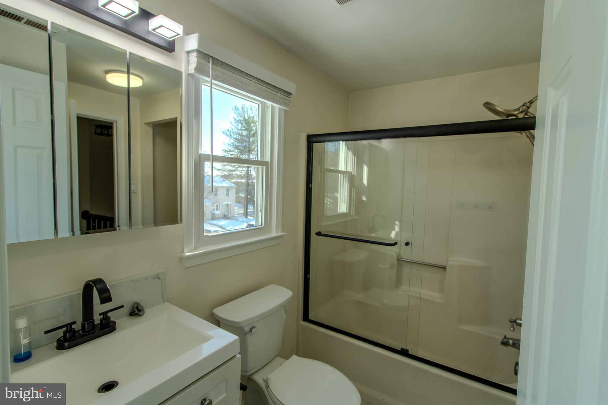 608 St Georges Station Road Reisterstown, MD 21136 - Photo 15 of 30 a bathroom with a sink mirror toilet and shower