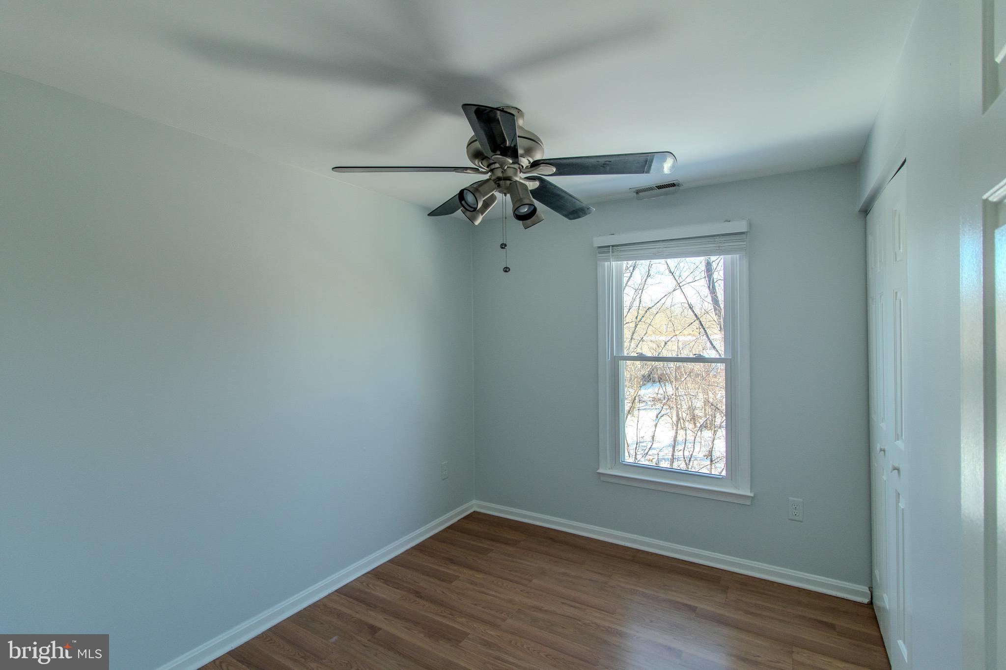 608 St Georges Station Road Reisterstown, MD 21136 - Photo 17 of 30 wooden floor in an empty room with a window