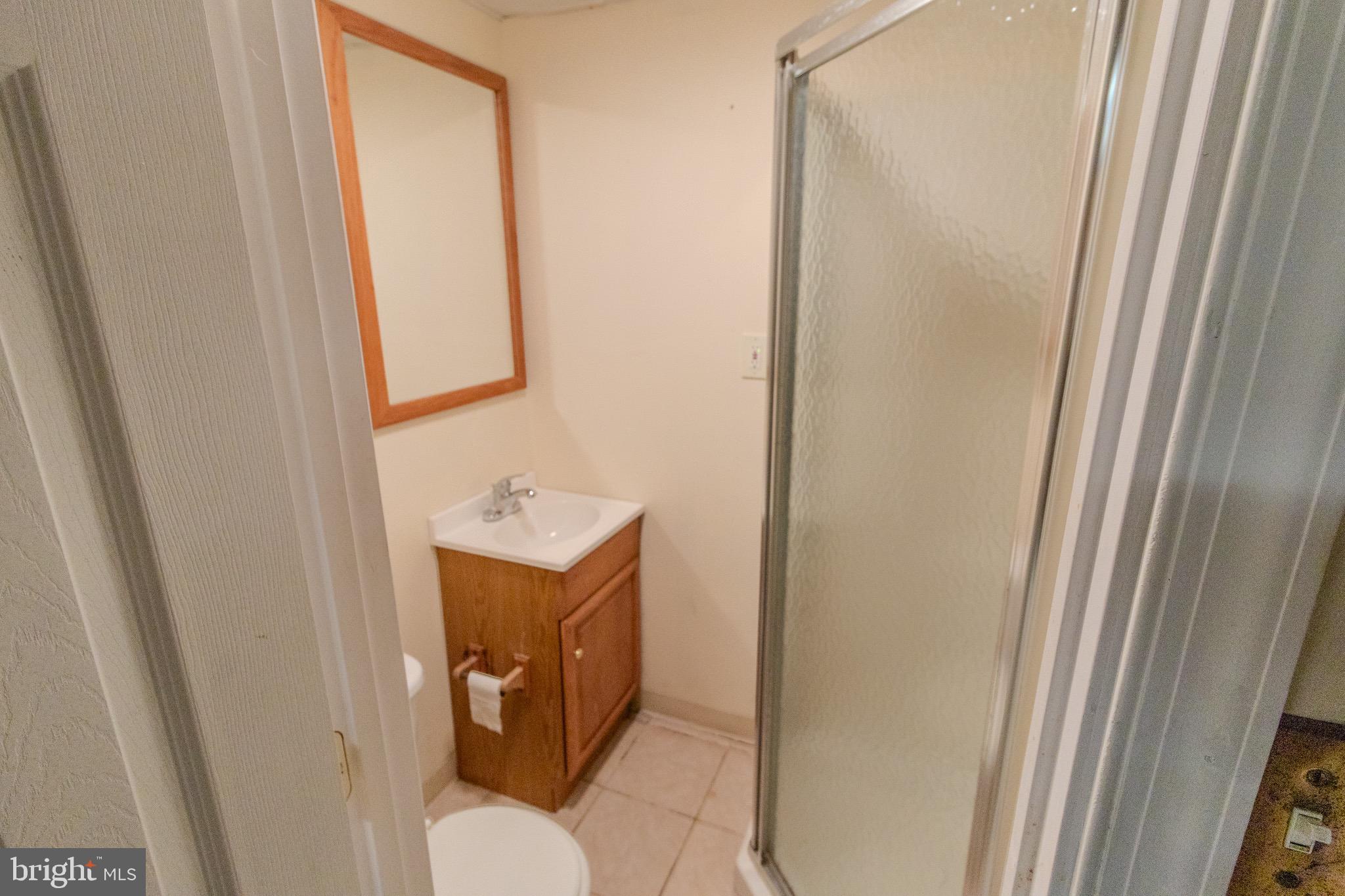 608 St Georges Station Road Reisterstown, MD 21136 - Photo 22 of 30 a bathroom with a sink and a mirror