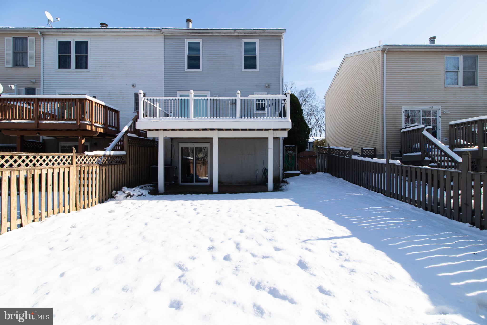 608 St Georges Station Road Reisterstown, MD 21136 - Photo 25 of 30 a front view of a house with glass doors and furniture