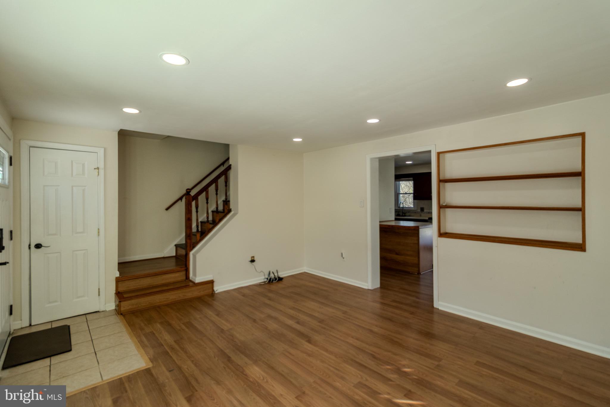 608 St Georges Station Road Reisterstown, MD 21136 - Photo 5 of 30 a view of room with stairs and wooden floor