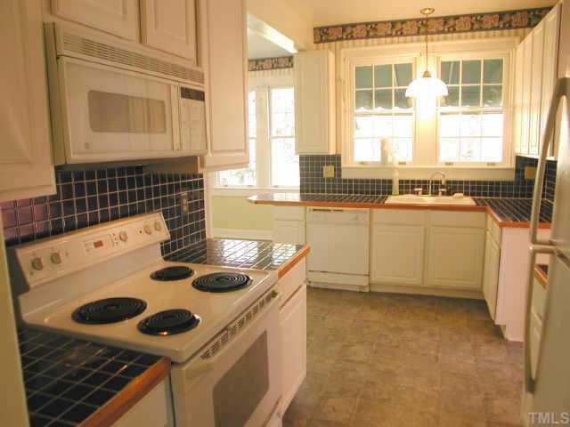 3 Henderson Street Raleigh, NC 27607 - Photo 4 of 7 The kitchen has a compact work area with good cabinet space...
