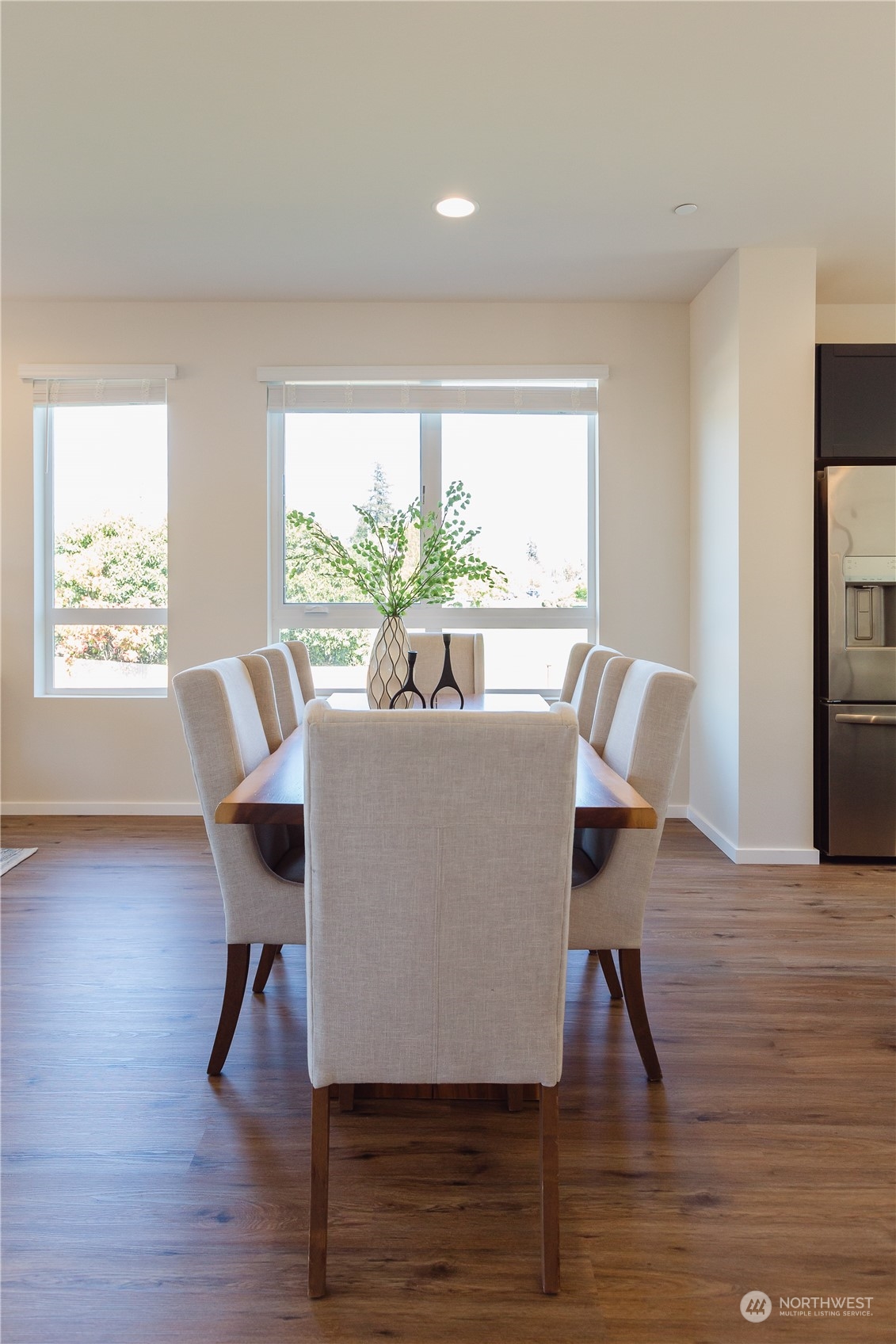 4226 148th Street Southeast, Unit C1 Bothell, WA 98012 - Photo 14 of 24 a view of a dining room with furniture window and wooden floor
