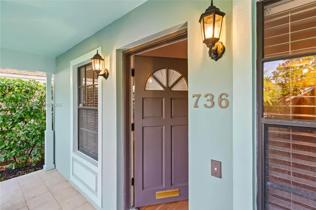 a view of a door and wooden floor