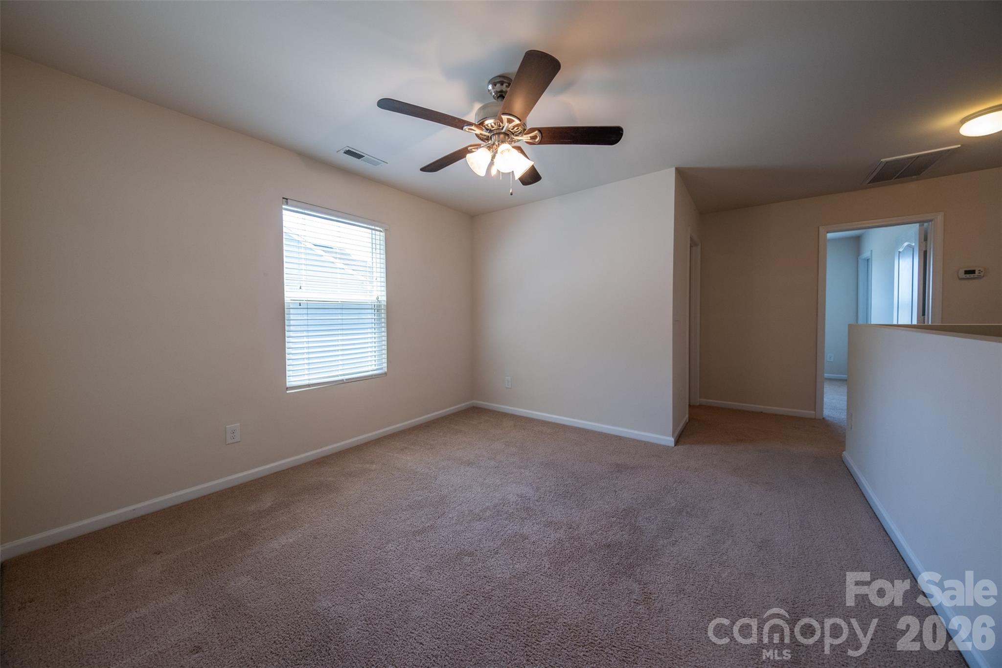 3006 Houndscroft Road Indian Trail, NC 28079 - Photo 22 of 39 an empty room with windows and fan