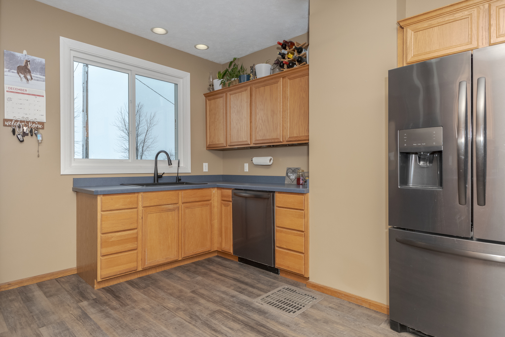 9948 North 100 E Road Gridley, IL 61744 - Photo 12 of 27 a kitchen with stainless steel appliances granite countertop a refrigerator sink and cabinets