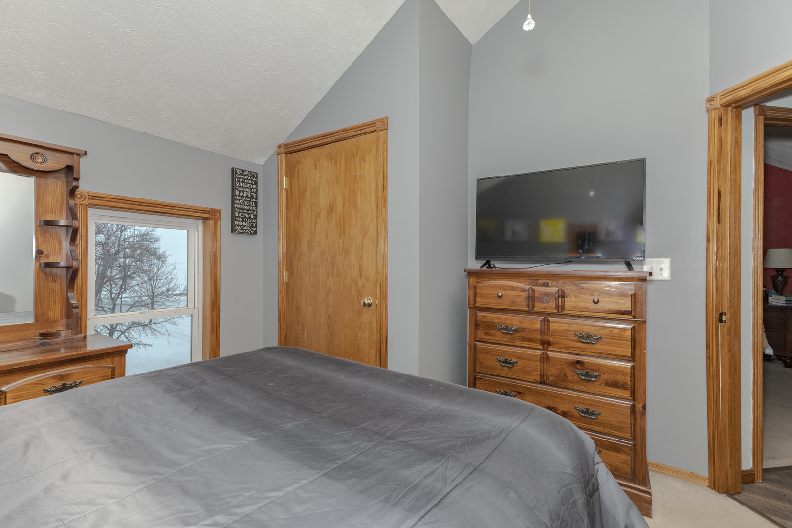 9948 North 100 E Road Gridley, IL 61744 - Photo 16 of 27 a bedroom with a bed and a flat screen tv